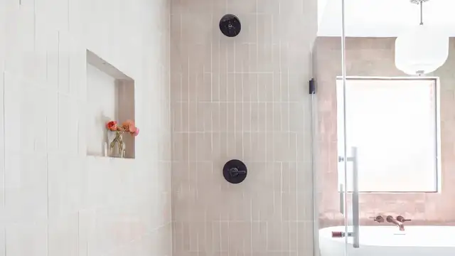 Normandy Residence shower in Midland with stacked white tile, a recessed niche, matte black controls and a frameless glass door
